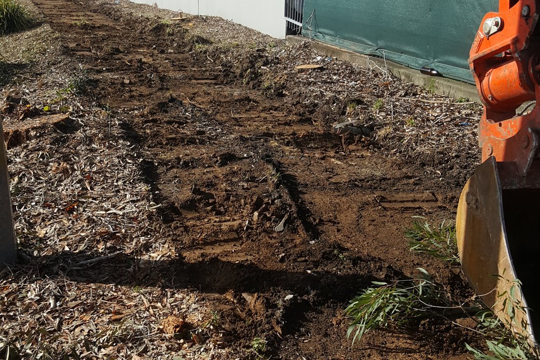 Stafford City — early-stage construction with fresh dirt and crew member on site